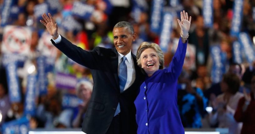 Then-President Barack Obama and then-Democratic presidential nominee Hillary Clinton acknowledge the crowd on the third day of the Democratic National Convention at the Wells Fargo Center in Philadelphia on July 27, 2016.