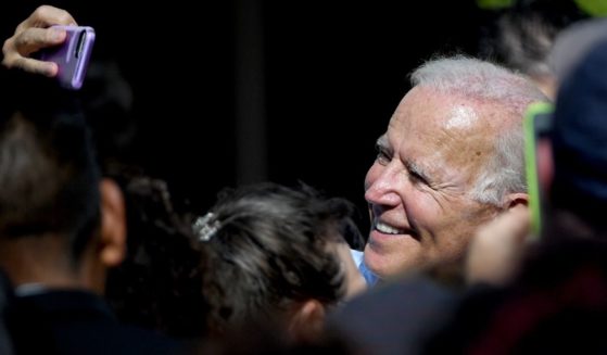 Then-Democratic presidential candidate Joe Biden takes a selfie with a voter after speaking at the East Las Vegas Community Center on Sept. 27, 2019.
