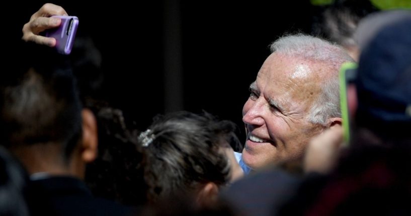 Then-Democratic presidential candidate Joe Biden takes a selfie with a voter after speaking at the East Las Vegas Community Center on Sept. 27, 2019.