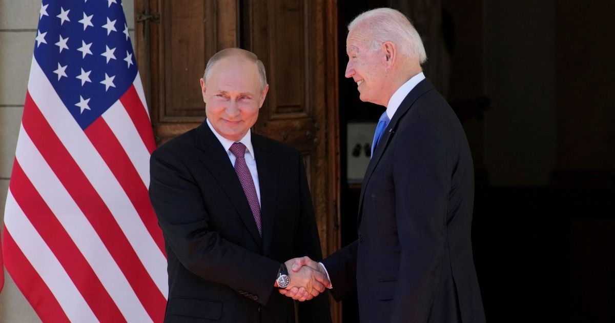 Russian President Vladimir Putin, left, shakes hands with U.S. President Joe Biden during their meeting at the Villa la Grange in Geneva on Wednesday.