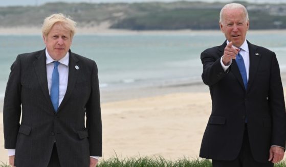 U.K. Prime Minister Boris Johnson, left, and U.S. President Joe Biden pose during the leaders official welcome and family photo during the G7 Summit on Friday in Cornwall, England.