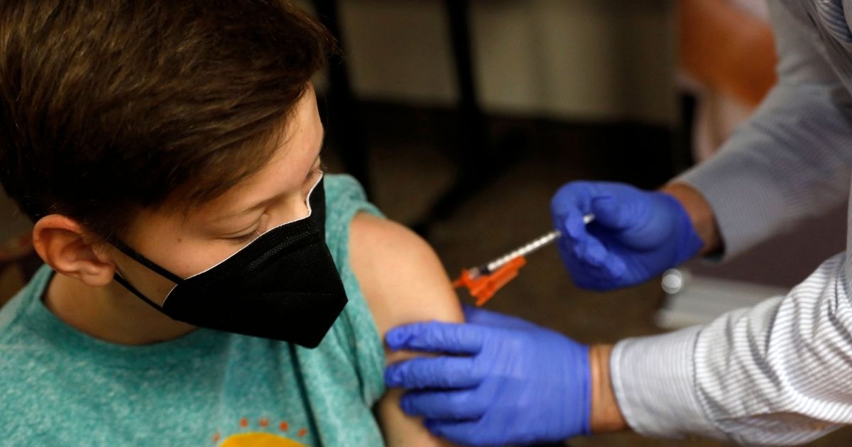 A boy receives the COVID-19 vaccine in Bloomfield Hills, Michigan, on May 13, 2021.