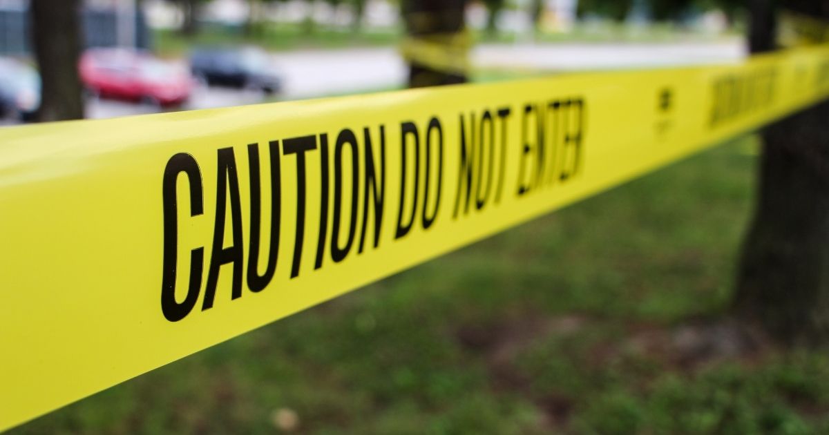 The above stock photo shows caution police tape.