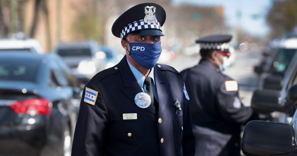 Police officers attend the funeral of Sgt. Clifford Martin, a 25-year veteran of the Chicago Police Department, on April 21, 2020, in Chicago.