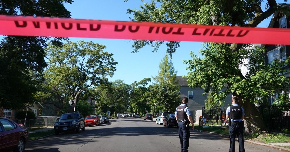 Police secure the scene of a shooting on June 15, 2021, in the Englewood neighborhood of Chicago.