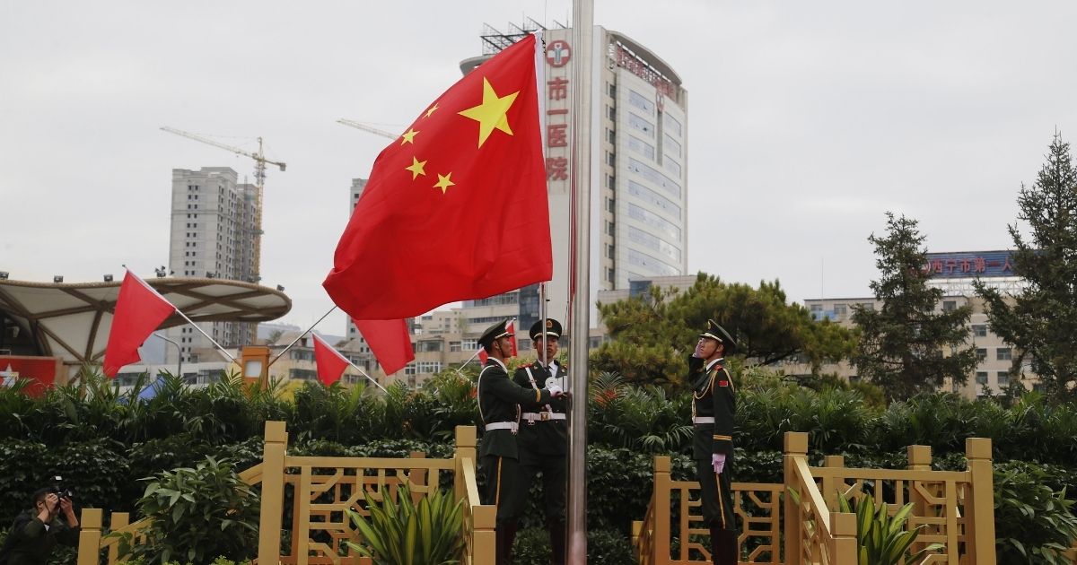 Soldiers of the People's Liberation Army honor guard perform a flag-raising ceremony to mark the 71st anniversary of the founding of the People's Republic of China in Xining on Oct. 1.
