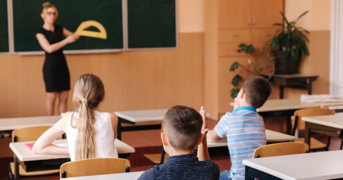 Children are pictured in an elementary school classroom in the stock image above.