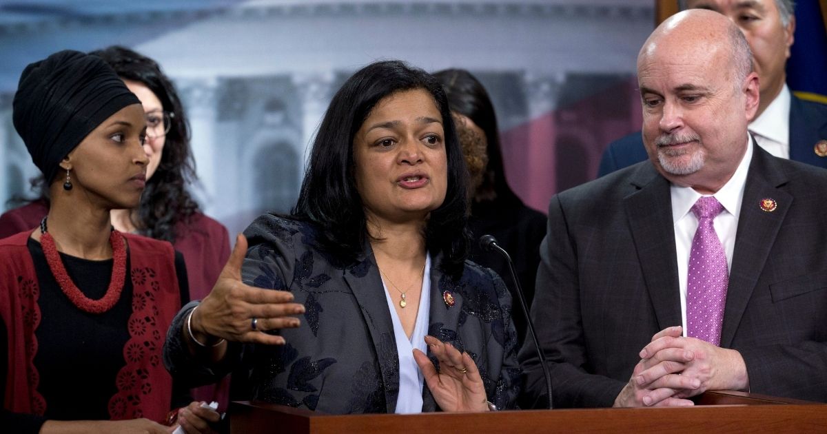 Rep. Pramila Jayapal of Washington, accompanied by fellow Democratic Reps. Ilhan Omar of Minnesota, left, and Mark Pocan of Wisconsin, speaks during a news conference on Capitol Hill in Washington on Jan. 8, 2020.