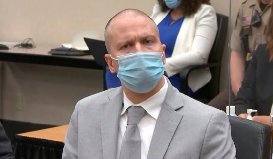 In this image taken from video, former Minneapolis police Officer Derek Chauvin listens as Hennepin County Judge Peter Cahill sentences him to 22 and a half years in prison on Friday.