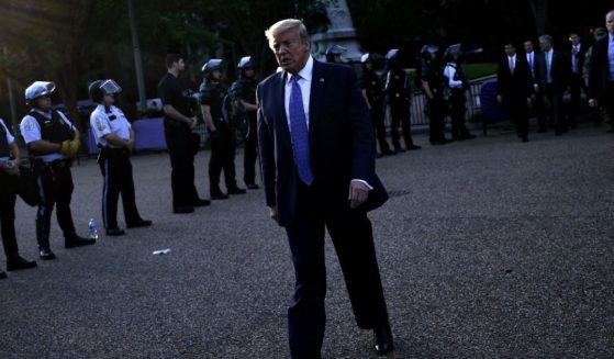 President Donald Trump walks back to the White House after appearing outside of St. John's Episcopal Church across Lafayette Park in Washington, D.C., on June 1, 2020.