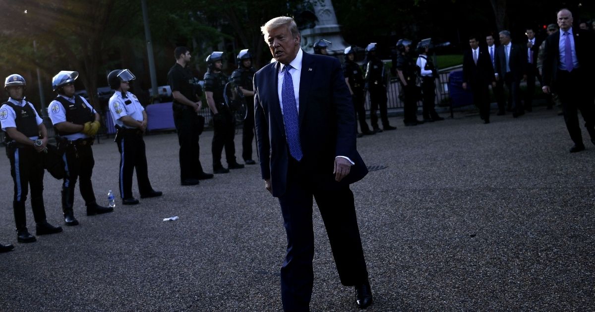 President Donald Trump walks back to the White House after appearing outside of St. John's Episcopal Church across Lafayette Park in Washington, D.C., on June 1, 2020.