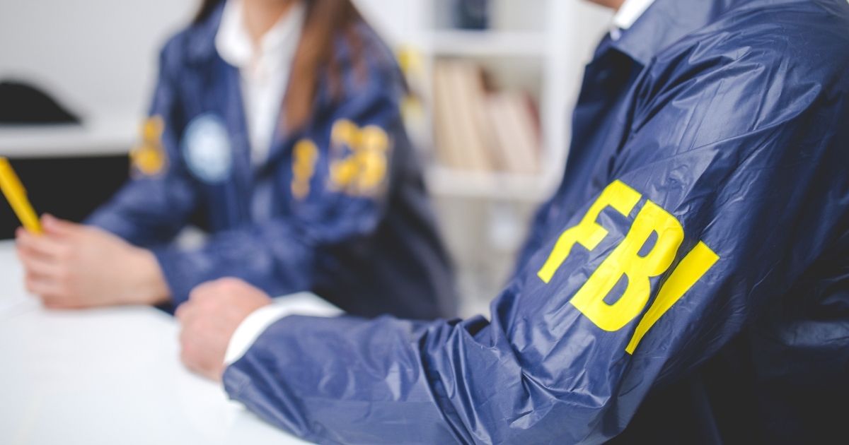 The above stock photo shows two FBI agents working.