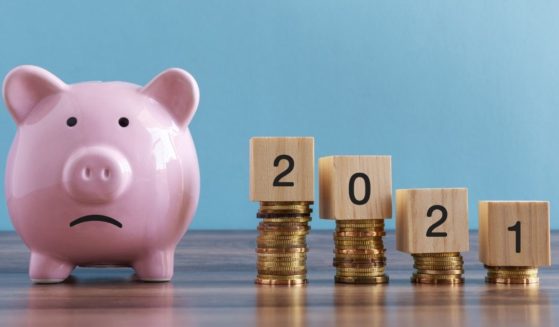 This stock photo portrays a piggy bank with a sad face painted on it. On Wednesday, the Federal Reserve held the federal funds rate at a low of 0 to .25 of a percent.