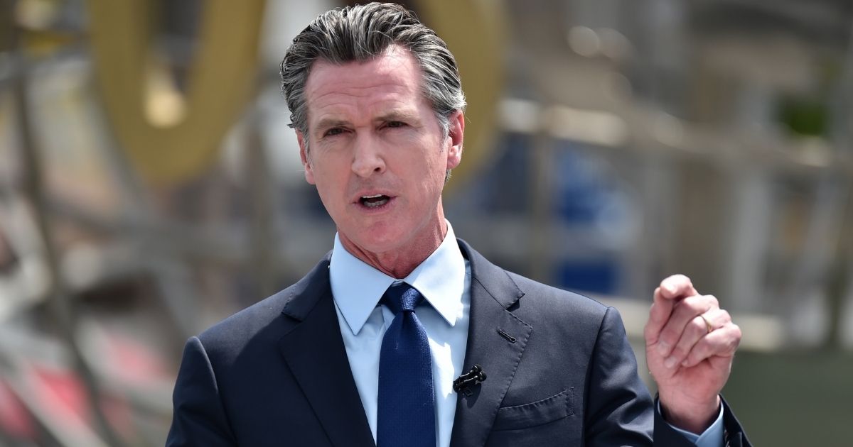 Democratic California Gov. Gavin Newsom attends a news conference for the official reopening of the state of California at Universal Studios Hollywood on June 15, 2021, in Universal City, California.