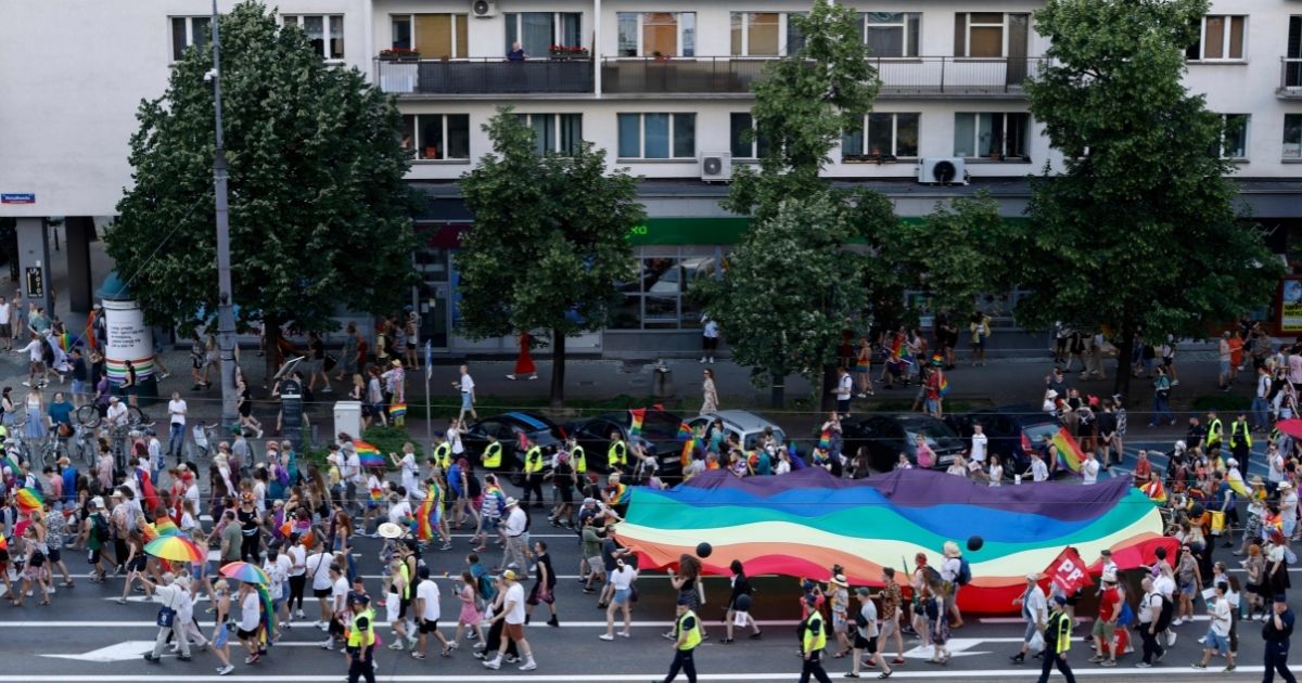 A general view shows people demonstrating with Gay Pride flags during the Gay Pride Parade in central Warsaw on Saturday.