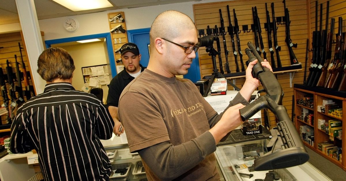Anthony Del Rosario of Nevada looks at a shotgun at The Gun Store on Nov. 14, 2008, in Las Vegas, Nevada.