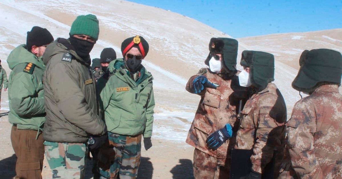 In this photograph provided by the Indian Army, army officers of India and China hold a meeting at Pangong lake region in Ladakh on the India-China border on Feb. 10, 2021.