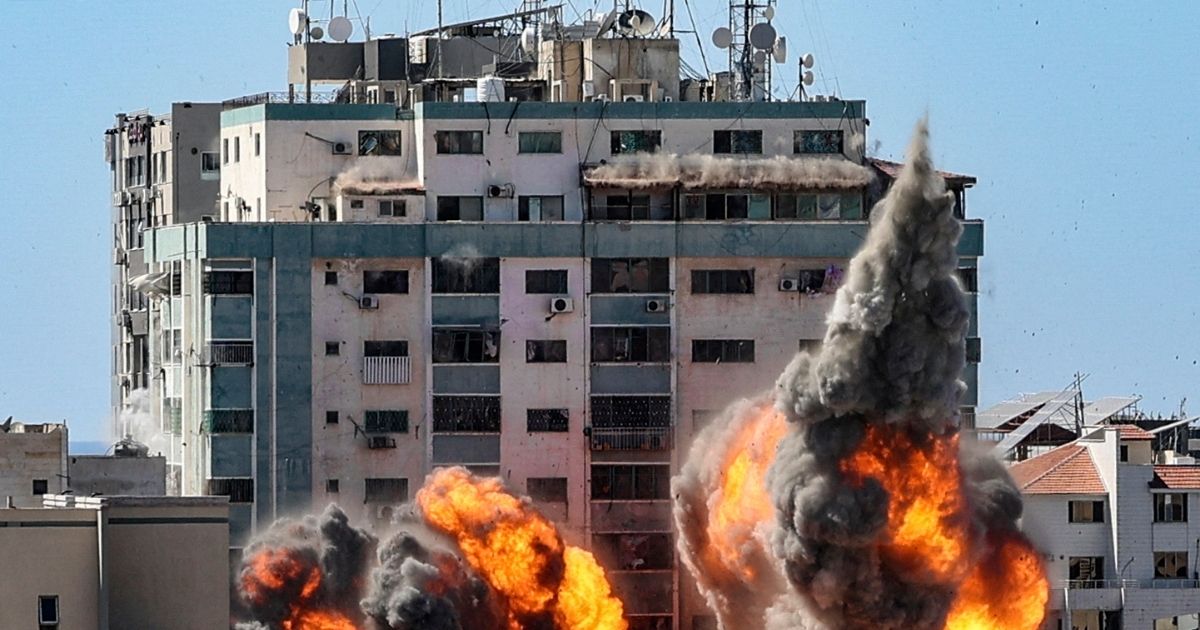 A ball of fire erupts from the Jala Tower, which housed an Associated Press bureau, as it is destroyed in an Israeli airstrike in Gaza City, controlled by Hamas terrorists, on May 15, 2021.