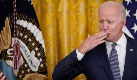 President Joe Biden blows a kiss to the audience before signing the Juneteenth National Independence Day Act into law in the East Room of the White House on Thursday in Washington, D.C.