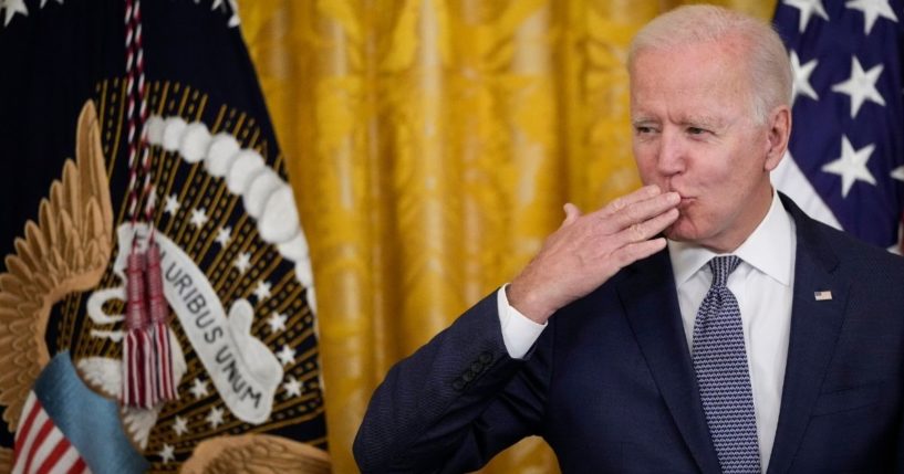 President Joe Biden blows a kiss to the audience before signing the Juneteenth National Independence Day Act into law in the East Room of the White House on Thursday in Washington, D.C.