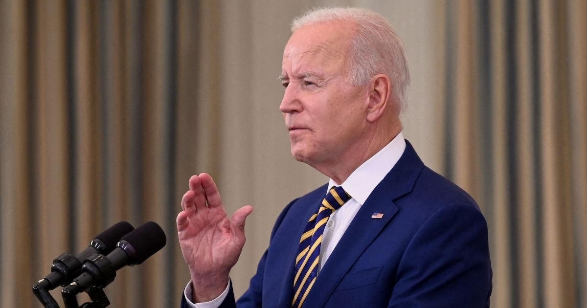 President Joe Biden speaks in the State Dining Room of the White House in Washington on Friday.
