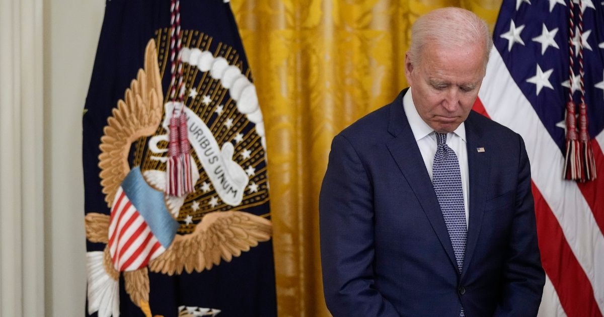 President Joe Biden waits to speak in the East Room of the White House on Thursday in Washington, D.C.