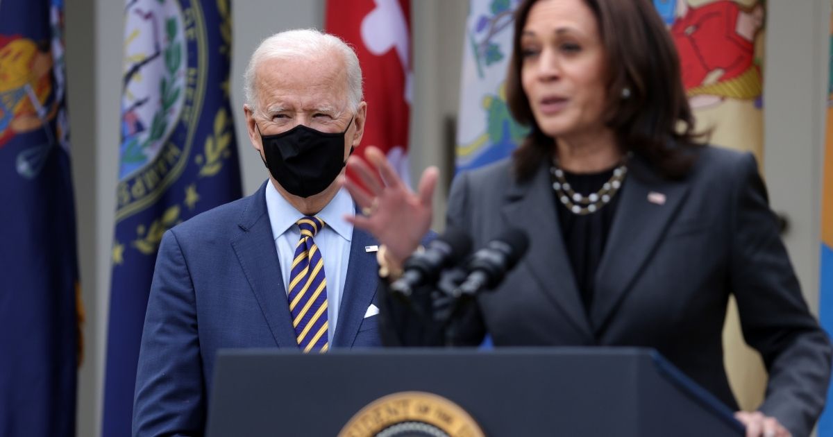 Vice President Kamala Harris, right, speaks as President Joe Biden listens during an event on the American Rescue Plan in the Rose Garden of the White House on March 12, 2021, in Washington, D.C.