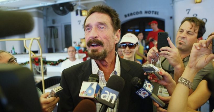 John McAfee talks to the media in 2012 in the photo above.