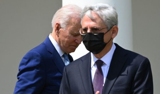 President Joe Biden and Attorney General Merrick Garland take part in an event about gun violence prevention in the Rose Garden of the White House in Washington, D.C., on April 8.