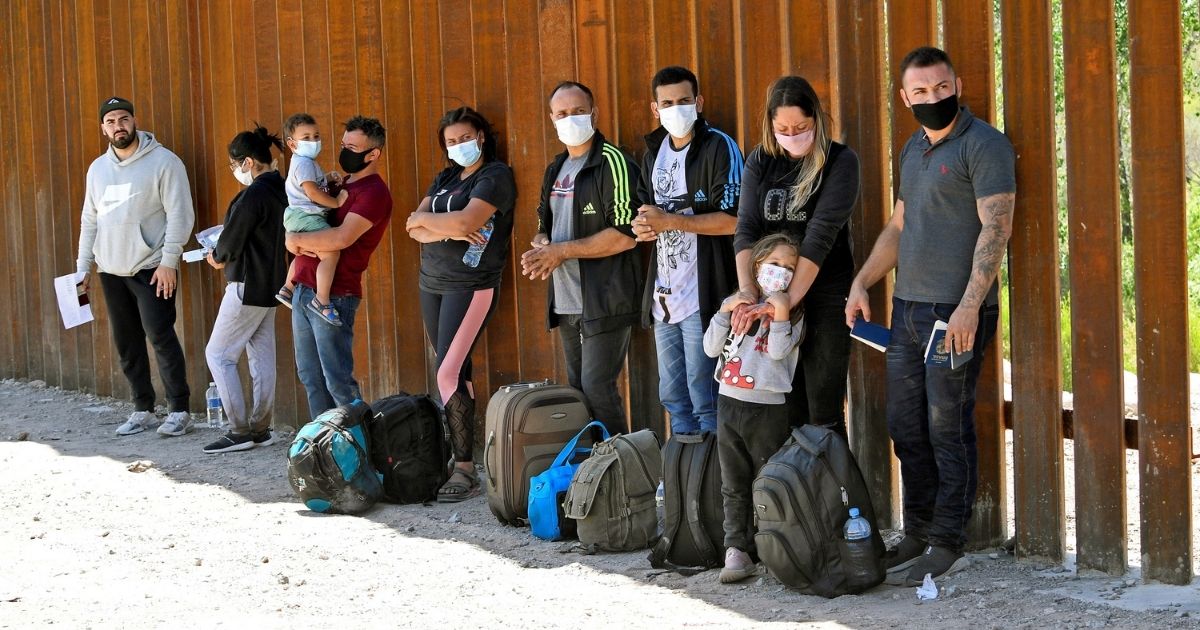 Migrants attempting to cross into the U.S. from Mexico are pictured at the border on May 21, 2021, in San Luis, Arizona.