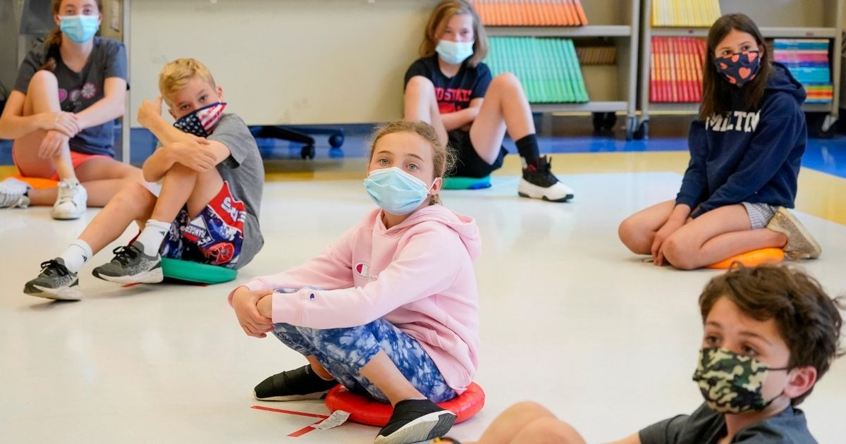 Fifth-graders wear face masks and are socially distanced during a music class at Milton Elementary School in Rye, New York, on May 18.