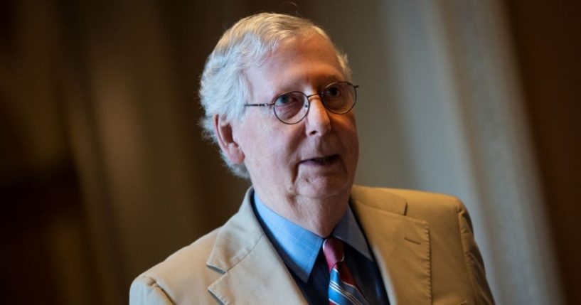 Senate Minority Leader Mitch McConnell walks to his office after speaking on the Senate floor at the U.S. Capitol on June 14, 2021.