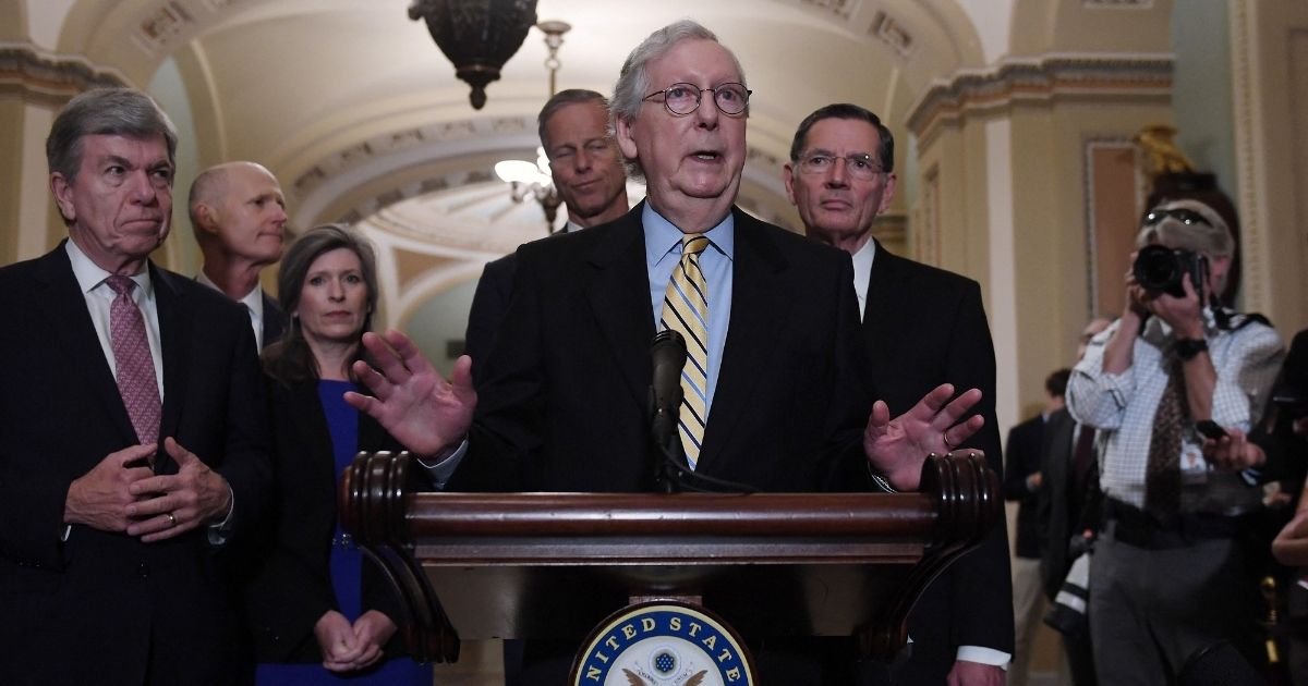 Senate Minority Leader Mitch McConnell, joined by fellow Senate Republicans, speaks about the so-called For the People Act at the U.S. Capitol in Washington on Wednesday.
