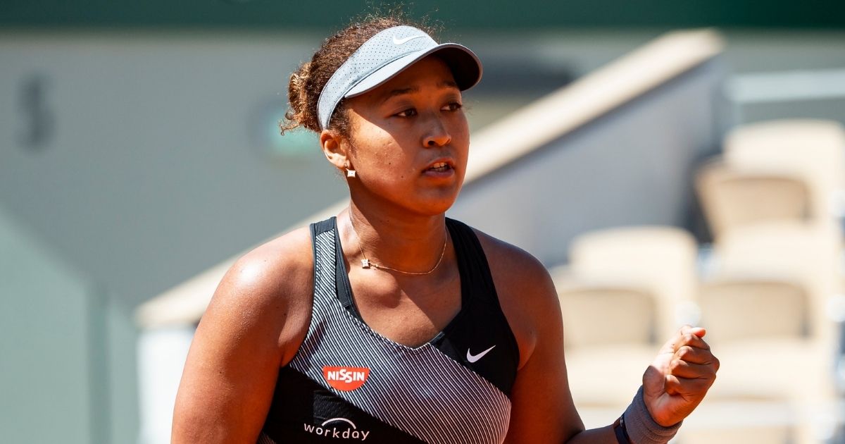 Naomi Osaka of Japan celebrates during her match against Patricia Maria Țig of Romania in the first round of the women’s singles at Roland Garros in Paris on Sunday.