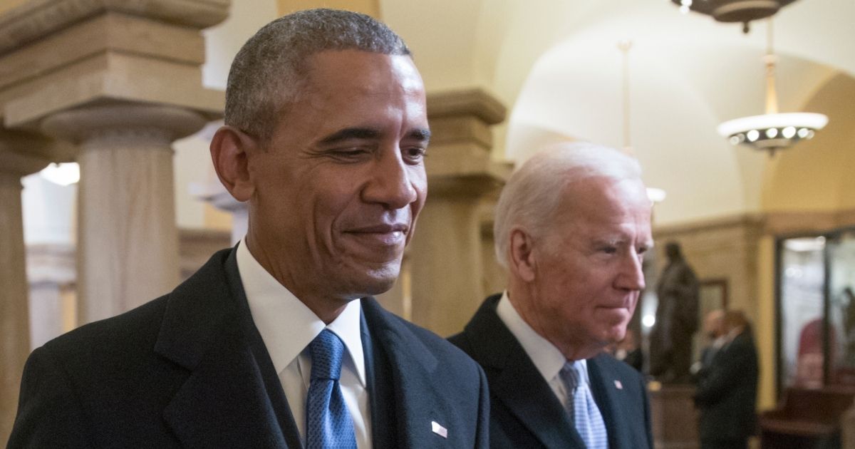 Barack Obama and Joe Biden walk through the Capitol for Donald Trump's inauguration ceremony in Washington on Jan. 20, 2017.