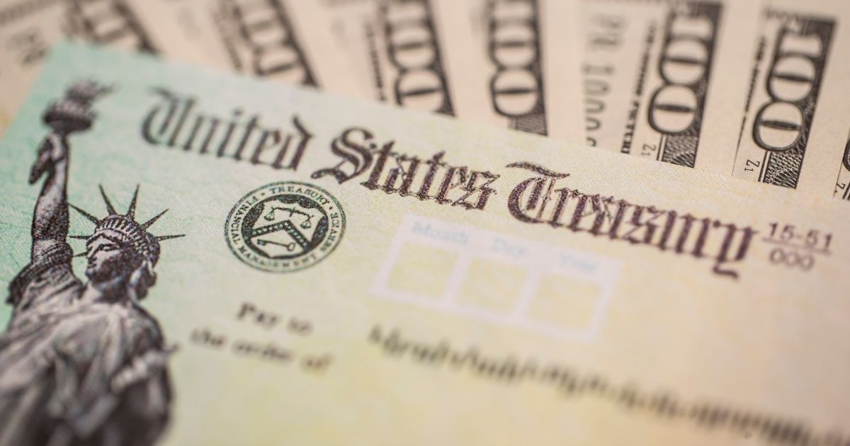 This stock photo shows a stimulus check that was sent out to American citizens during the COVID-19 pandemic. Some experts now believe as much as $400 billion has been paid out in fraudulent unemployment claims.