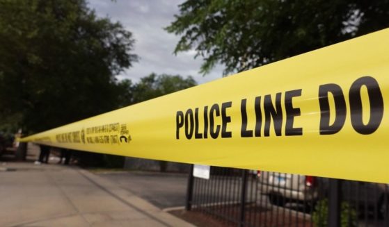 Police tape surrounds a crime scene where three people were shot at the Wentworth Gardens housing complex in the Bridgeport neighborhood on Wednesday in Chicago.
