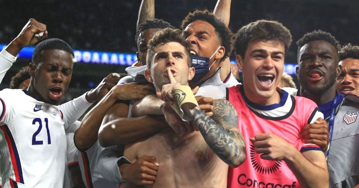 Christian Pulisic and his U.S. teammates celebrate after his game-winning goal against Mexico.