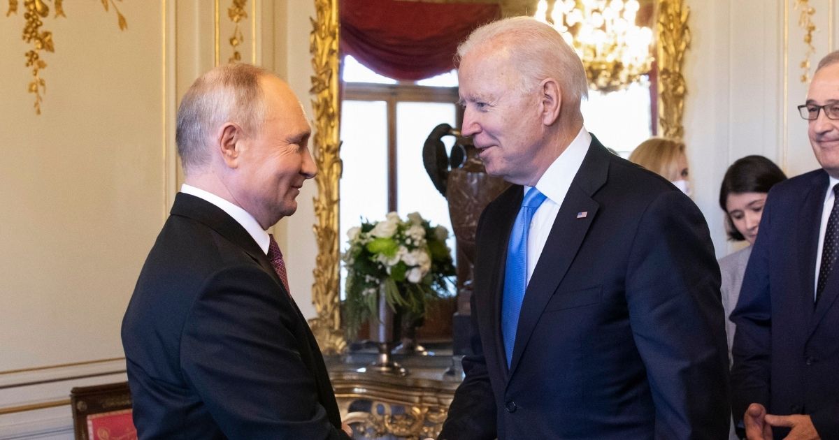 President Joe Biden (2L) and Russian President Vladimir Putin shake hands as Swiss President Guy Parmelin (R) looks on during the U.S.-Russia summit at Villa La Grange on June 16, 2021 in Geneva, Switzerland.