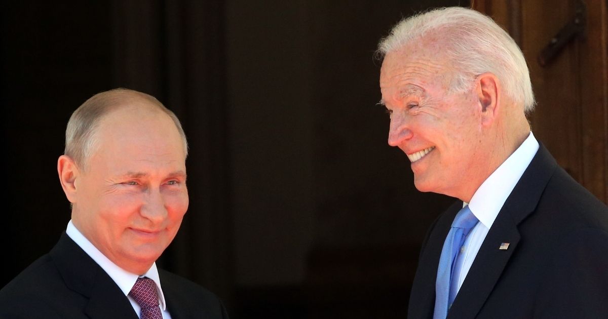 Russian President Vladimir Putin, left, greets a smiling President Joe Biden at the La Grange Villa in Geneva on Wednesday.