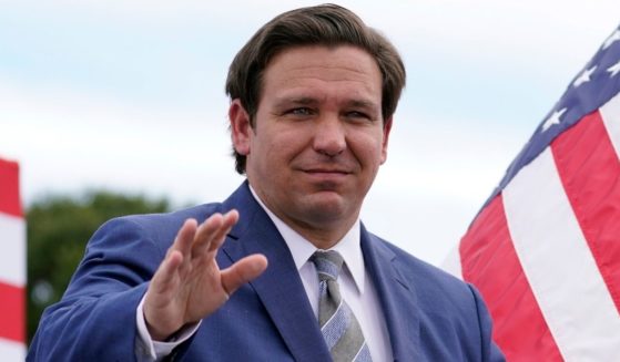 Florida Gov. Ron DeSantis attends an event with then-President Donald Trump at the Jupiter Inlet Lighthouse and Museum in Jupiter, Florida, on Sept. 8.