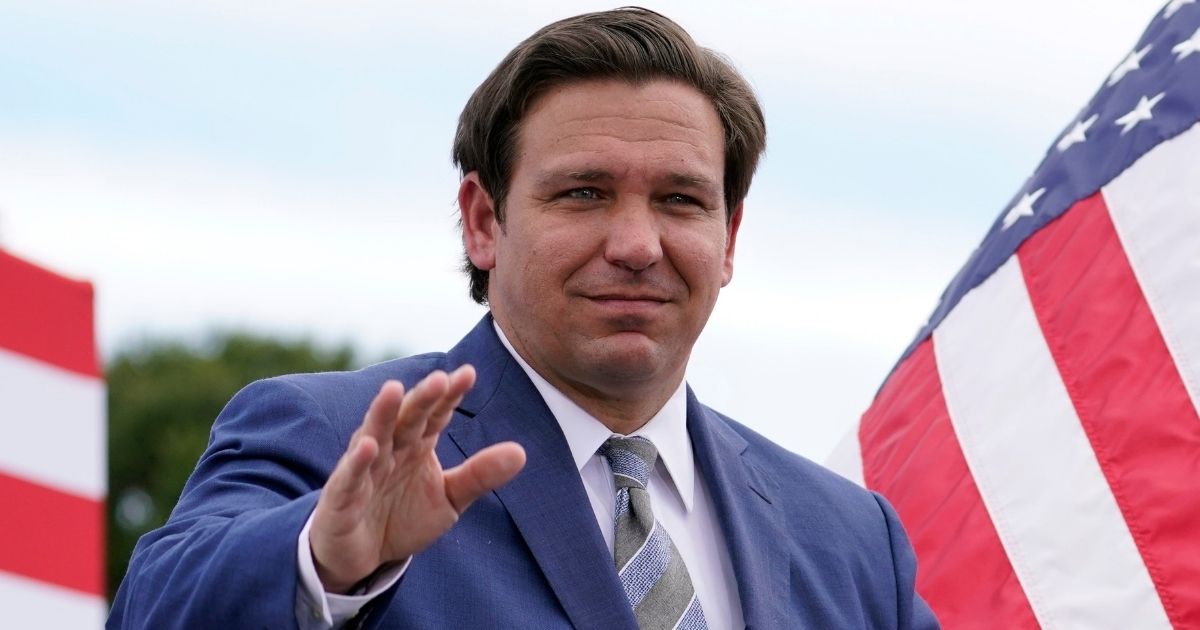 Florida Gov. Ron DeSantis attends an event with then-President Donald Trump at the Jupiter Inlet Lighthouse and Museum in Jupiter, Florida, on Sept. 8.