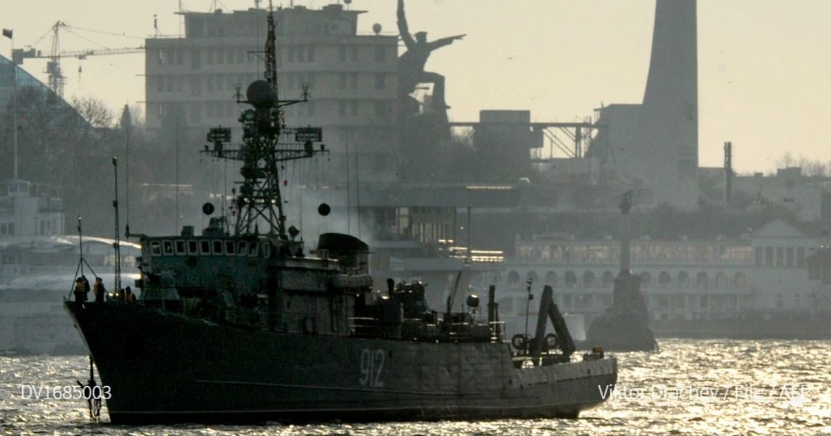 Russia says it fired warning shots when a British destroyer crossed into waters it claims as its territory in the Black Sea near Ukraine on Wednesday.