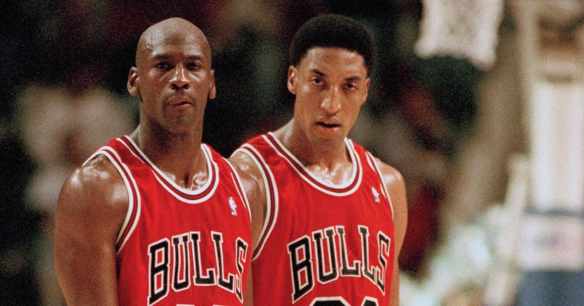 Then-Chicago Bulls players Michael Jordan, left, and Scottie Pippen return to the floor after a timeout in the fourth quarter against the Indiana Pacers, on March 19, 1995, in Indianapolis.