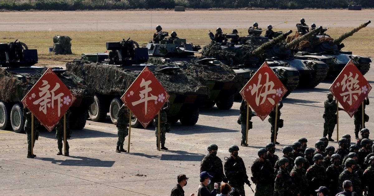 Taiwan's Army troops display signs for photographs after a drill in Hsinchu military base ahead of the Chinese New Year holiday on Jan. 19, 2021.