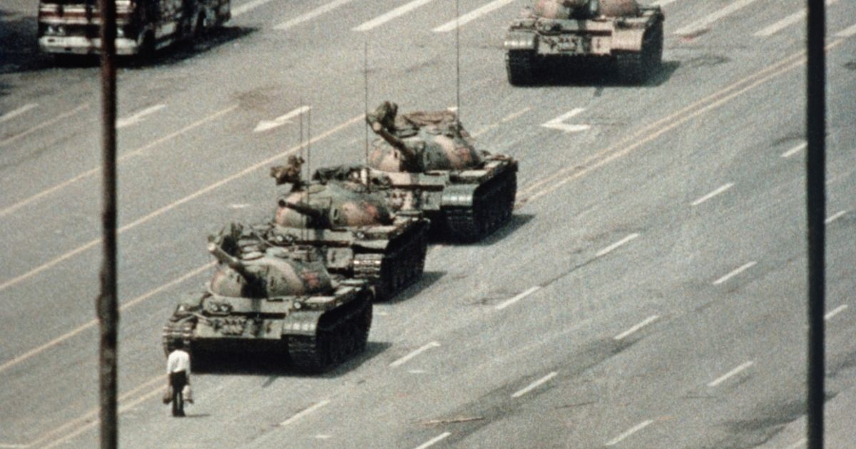 A demonstrator, now immortalized as "Tank Man," blocks the path of a tank convoy along the Avenue of Eternal Peace near Tiananmen Square in Beijing on June 4, 1989.
