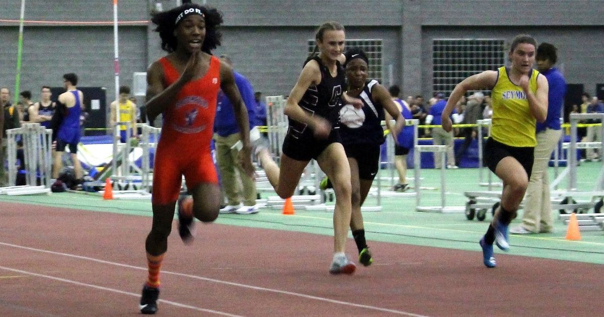 Bloomfield High School transgender athlete Terry Miller, left, wins the final of the 55-meter dash in the Connecticut girls Class S indoor track meet at Hillhouse High School in New Haven on Feb. 7, 2019.