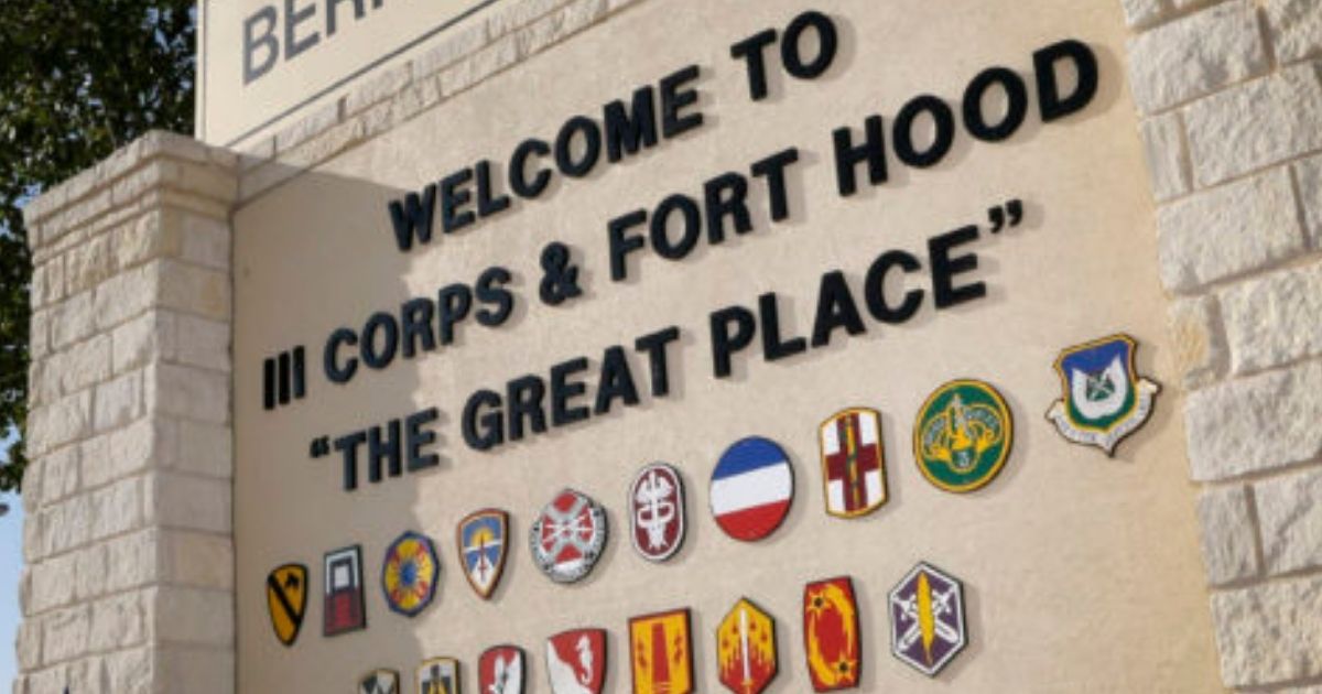 In this July 9, 2013, file photo, traffic flows through the main gate past a welcome sign in Fort Hood, Texas.