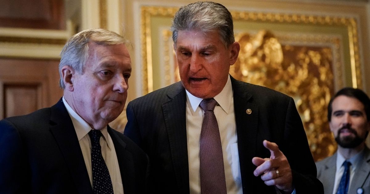 West Virginia Sen. Joe Manchin, right, is pictured with fellow Democrat Sen. Dick Durbin of Illinois in a file photo from Jan. 28, 2020.