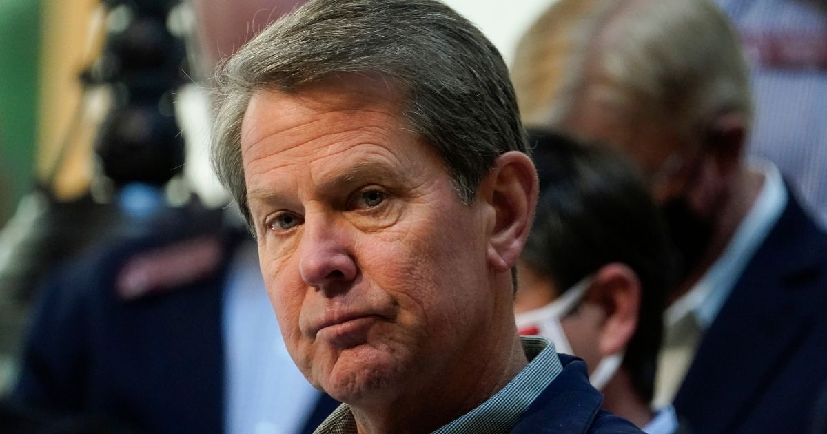 Georgia Gov. Brian Kemp frowns in a file photo from an April news conference in Atlanta.